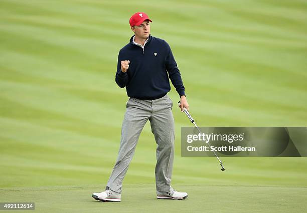 Jordan Spieth of the United States Team celebrates a birdie putt on the ninth hole during the Saturday afternoon four-ball matches at The Presidents...