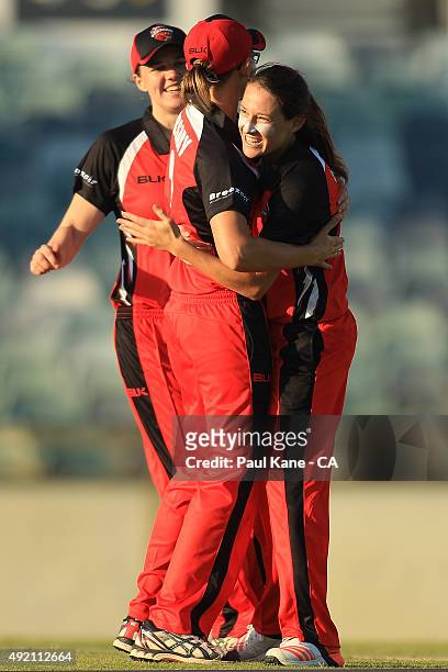 Megan Schutt of South Australia celebrates with Lauren Ebsary after the run-out of Rene Farrell of New South Wales and winning the round one WNCL...