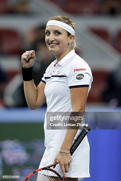 Timea Bacsinszky of Switzerland celebrates after winning her match against Ana Ivanovic of Serbia during the Women's singles semi-finals match on day...