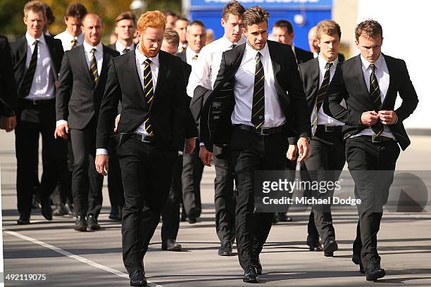 Todd Banfield Brett Deledio and Nathan Foley of the Tigers arrive during the public service for Tom Hafey at Melbourne Cricket Ground on May 19, 2014...