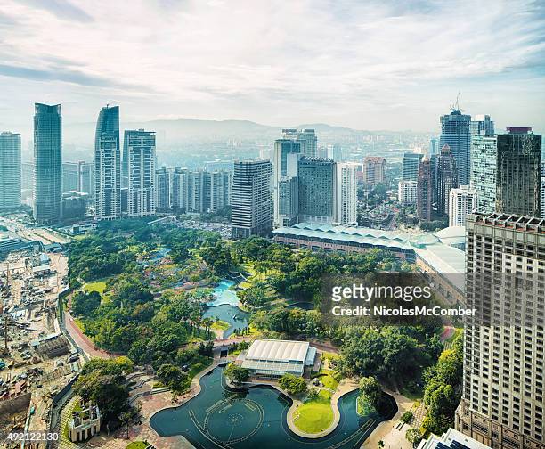 kuala lumpur skyline with kl city park aerial - kuala lumpur stock pictures, royalty-free photos & images