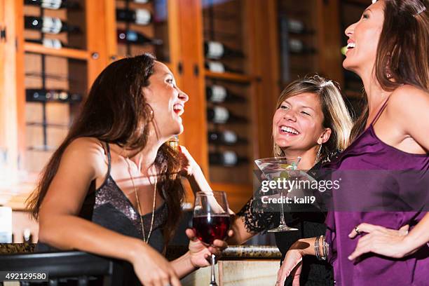 ladies night out, having fun at a bar - cocktail counter stock pictures, royalty-free photos & images