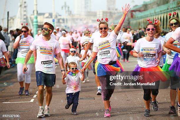 Runners take part in The Color Run on October 10, 2015 in Brighton, England. The Color Run took place at Brighton's Madeira Drive on 10th October...