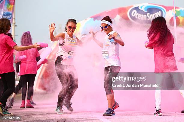 Runners take part in The Color Run on October 10, 2015 in Brighton, England. The Color Run took place at Brighton's Madeira Drive on 10th October...