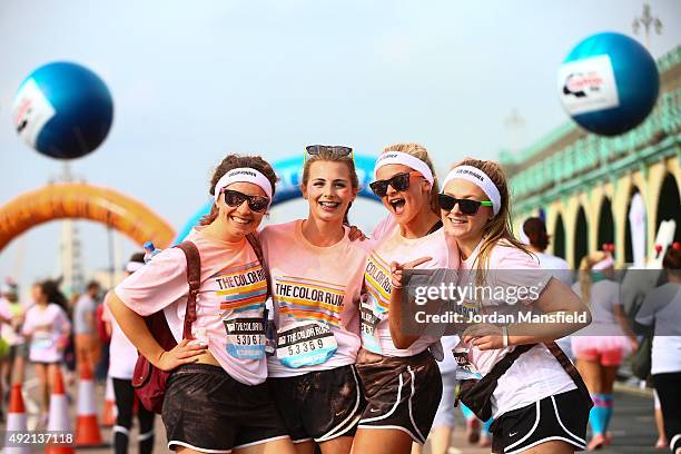 Runners take part in The Color Run on October 10, 2015 in Brighton, England. The Color Run took place at Brighton's Madeira Drive on 10th October...