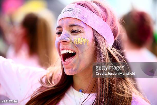 Runners celebrate in the Festival Area after The Color Run on October 10, 2015 in Brighton, England. The Color Run took place at Brighton's Madeira...