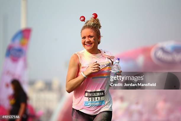 Runners take part in The Color Run on October 10, 2015 in Brighton, England. The Color Run took place at Brighton's Madeira Drive on 10th October...