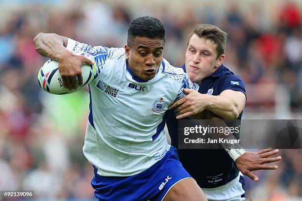 Rey Lee-Lo of Samoa is tackled by Mark Bennett of Scotland during the 2015 Rugby World Cup Pool B match between Samoa and Scotland at St James' Park...