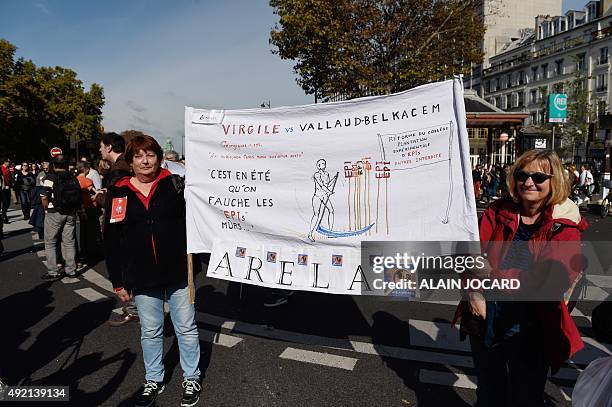 Women hold a banner reading "Virgil vs Vallaud-Belkacem" during a demonstration in Paris on October 10 against proposed middle school reforms....