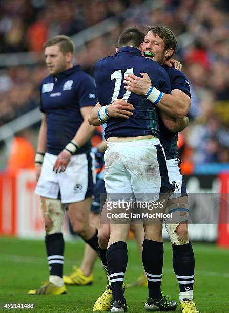 Tommy Seymour of Scotland is hugged by Peter Horne of Scotland at full time during the 2015 Rugby World Cup Pool B match between Samoa and Scotland...
