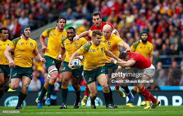 Drew Mitchell of Australia makes a break during the 2015 Rugby World Cup Pool A match between Australia and Wales at Twickenham Stadium on October...