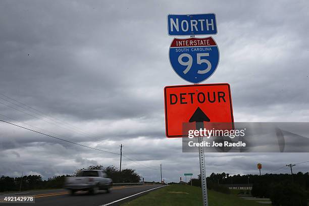 Detour sign helps drivers find their way around a closed I-95 as a 13 mile portion of the major east coast highway continues to be closed due to...