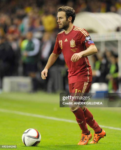 Spains midfielder Juan Mata controls the ball during the Euro 2016 qualifying football match Spain vs Luxembourg at Las Gaunas stadium in Logrono on...