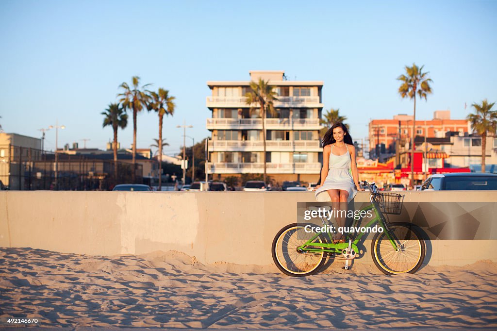 Girl Sitting With Bike at Beach