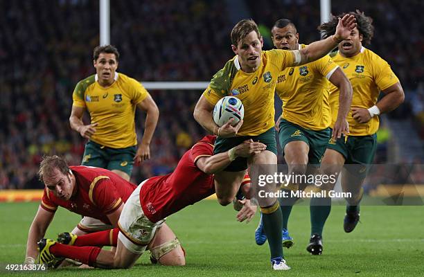 Bernard Foley of Australia is tackled by Gareth Anscombe of Wales during the 2015 Rugby World Cup Pool A match between Australia and Wales at...