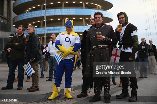 England supporters in fancy dress watch the Wales v Australia match on a giant screen outside the stadium ahead of the 2015 Rugby World Cup Pool A...