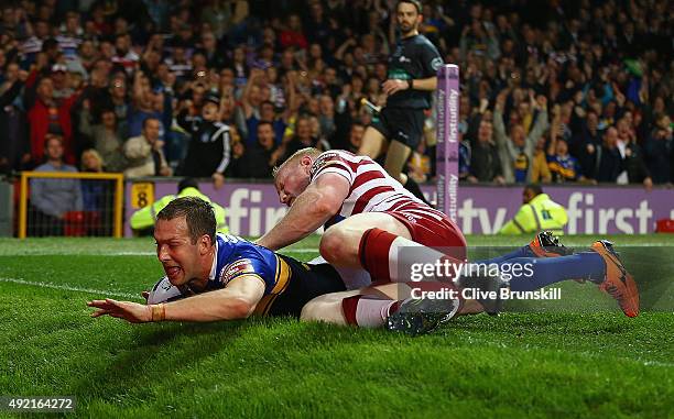 Danny McGuire of the Leeds Rhinos scores his teams third try against of the Wigan Warriors during the First Utility Super League Grand Final between...