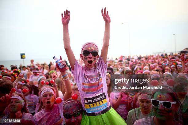 Runners celebrate in the Festival Area after The Color Run on October 10, 2015 in Brighton, England. The Color Run took place at Brighton's Madeira...