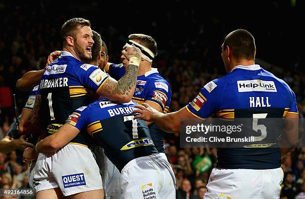 Zak Hardaker of the Leeds Rhinos celebrates after team mate Danny McGuire has scored his teams third try against of the Wigan Warriors during the...
