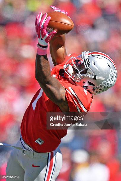 Braxton Miller of the Ohio State Buckeyes stretches to snag a 33-yard reception in the second quarter against the Maryland Terrapins at Ohio Stadium...