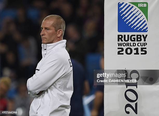 England's head coach Stuart Lancaster stands on the pitch ahead of kick off of the Pool A match of the 2015 Rugby World Cup between England and...