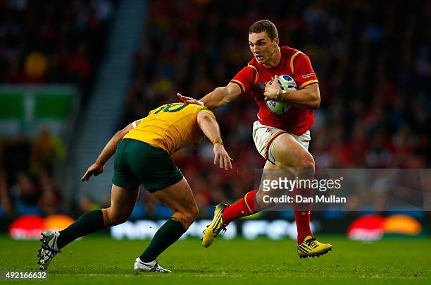 George North of Wales is tackled by Bernard Foley of Australia during the 2015 Rugby World Cup Pool A match between Australia and Wales at Twickenham...
