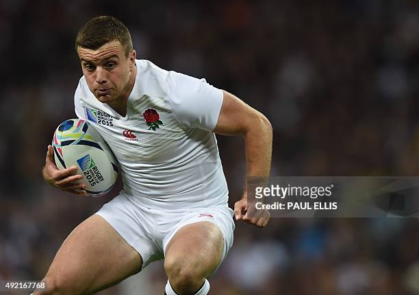 England's fly half George Ford runs with the ball during the Pool A match of the 2015 Rugby World Cup between England and Uruguay at Manchester City...