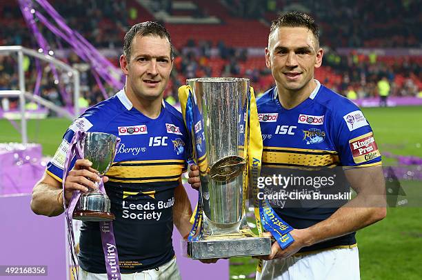 Kevin Sinfield captain of the Leeds Rhinos celebrates as he holds the trophy with his team mate and man of the match Danny McGuire after the First...