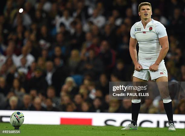 England's centre Owen Farrell prepares to kick a conversion during the Pool A match of the 2015 Rugby World Cup between England and Uruguay at...