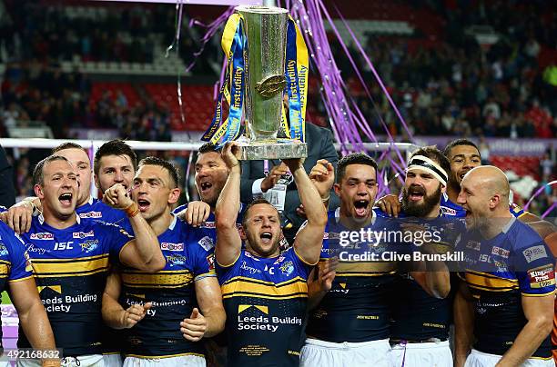 Rob Burrow of the Leeds Rhinos celebrates as he holds the trophy aloft with his team mates after the First Utility Super League Grand Final between...