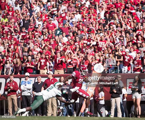 Ryquell Armstead of the Temple Owls scores a touchdown past Darion Monroe of the Tulane Green Wave on October 10, 2015 at Lincoln Financial field in...