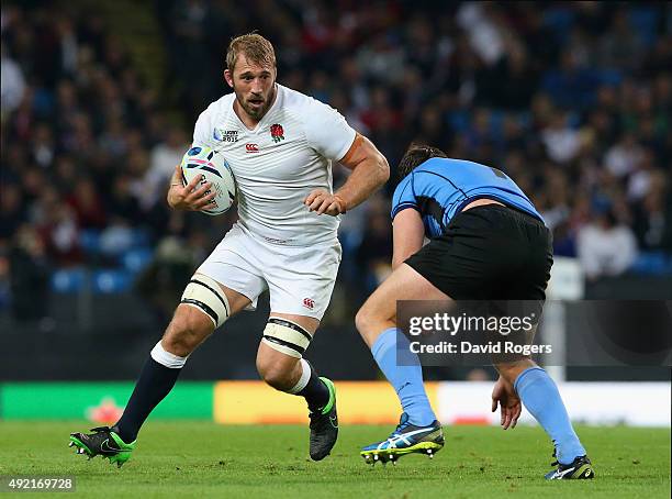 Chris Robshaw of England takes on Matias Beer of Uruguay during the 2015 Rugby World Cup Pool A match between England and Uruguay at Manchester City...