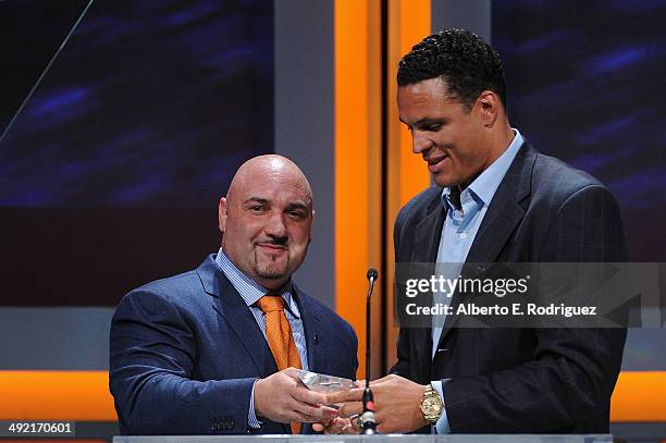 Personality Jay Glazer presents former NFL player Tony Gonzalez with the Lifetime Achievement Award on stage at the 2014 Sports Spectacular Gala at...