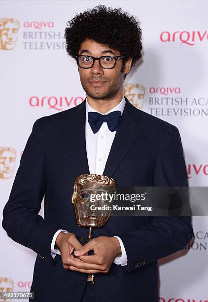 Richard Ayoade holds the Male Performance in a Comedy Programme Award for the IT Crowd', at the Arqiva British Academy Television Awards held at the...