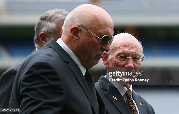 Rex Hunt and Kevin Bartlett walk around the boundary to form a guard of honour during the public service for Tom Hafey at Melbourne Cricket Ground on...