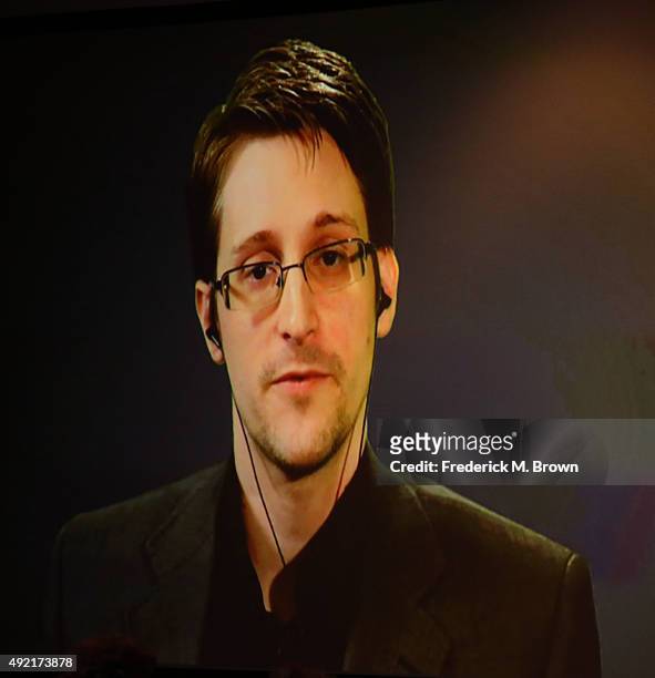 Edward Snowden is seen on a monitor as he speaks druing a live video feed during Politicon at the Los Angeles Convention Center on October 10, 2015...