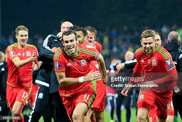 Gareth Bale David Cotterill and Simon Church celebrate after the Euro 2016 qualifying football match between Bosnia and Herzegovina and Wales at the...