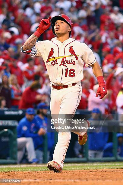 Kolten Wong of the St. Louis Cardinals celebrates after hitting a solo home run in the fifth inning against the Chicago Cubs during game two of the...