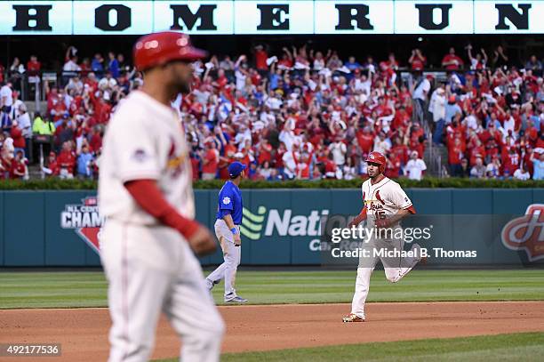 Randal Grichuk of the St. Louis Cardinals runs the bases after hitting a solo home run in the fifth inning against the Chicago Cubs during game two...