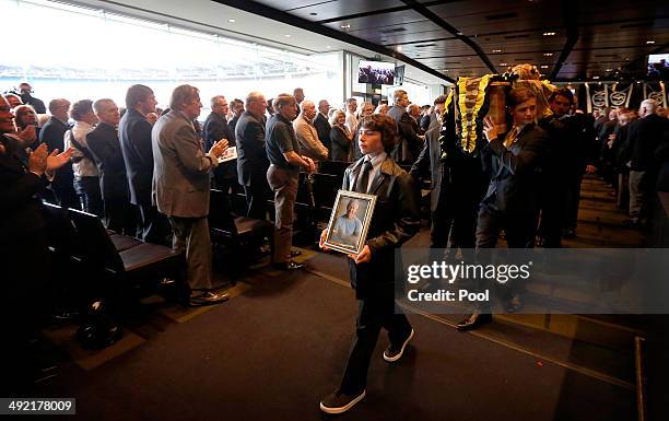 The casket is carried out by his grandsons after the Tom Hafey funeral service at Melbourne Cricket Ground on May 19, 2014 in Melbourne, Australia....