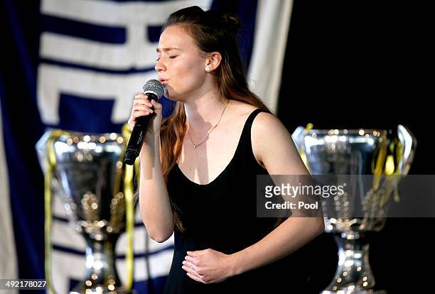 Tom Hafey's grand-daughter Samantha Hafey-Bagg sings 'Dream A Little Dream' in tribute during the Tom Hafey funeral service at Melbourne Cricket...