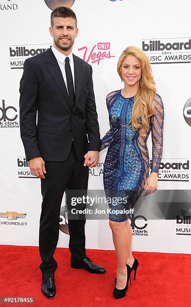 Singer Shakira and Gerard Pique arrive at the 2014 Billboard Music Awards at the MGM Grand Hotel and Casino on May 18, 2014 in Las Vegas, Nevada.