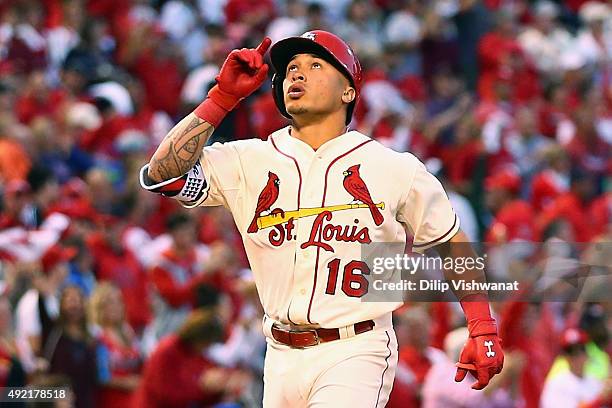 Kolten Wong of the St. Louis Cardinals celebrates after hitting a solo home run in the fifth inning against the Chicago Cubs during game two of the...