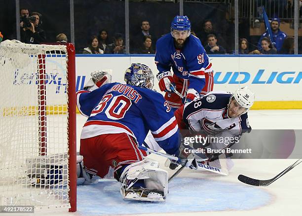 Henrik Lundqvist of the New York Rangers makes the first period save on Boone Jenner of the Columbus Blue Jackets at Madison Square Garden on October...