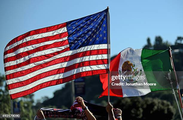 Flags of the United States and Mexico wave before the 2017 FIFA Confederations Cup Qualifier at Rose Bowl on October 10, 2015 in Pasadena, California.