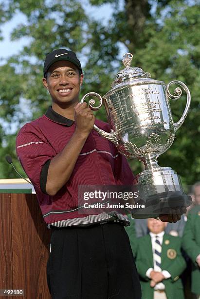 Tiger Woods hoists the Wanamaker Trophy after capturing the PGA Championship at Medinah Country Club in Medinah, Illinois. Mandatory Credit: Jamie...