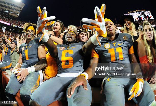 Jalen Hurd, Alvin Kamara, and Joshua Dobbs of the Tennessee Volunteers celebrate with fans after the game against the Georgia Bulldogs on October 10,...