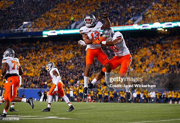 Jordan Sterns of the Oklahoma State Cowboys celebrates after recovering a fumble by Rushel Shell of the West Virginia Mountaineers in the first half...