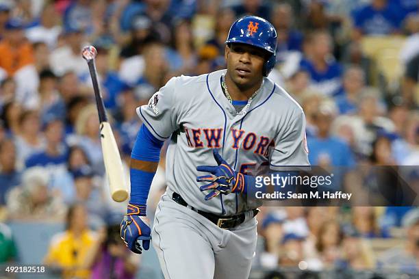 Yoenis Cespedes of the New York Mets throws his bat after hitting a solo home run in the second inning against the Los Angeles Dodgers in game two of...