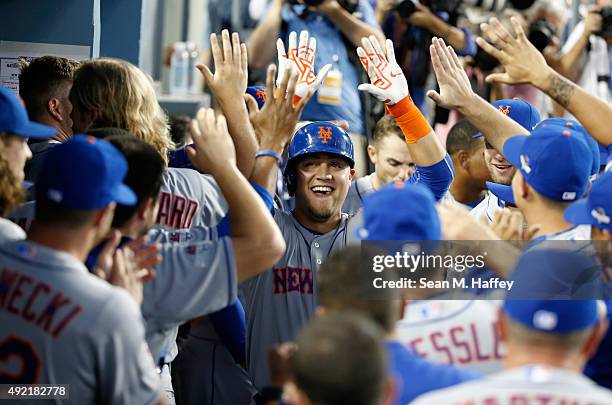 Michael Conforto of the New York Mets celebrates after hitting a solo home run in the second inning against the Los Angeles Dodgers in game two of...